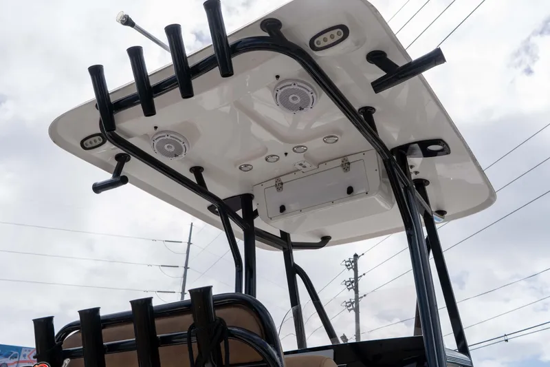 Slide: The Image of 2023 Sea Hunt Ultra 229 boat T-top with rod holders and speakers. - 29
