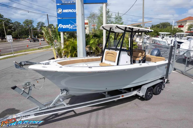 Slide: The Image of 2023 Sea Hunt Ultra 229 boat on trailer at dealership. - 3