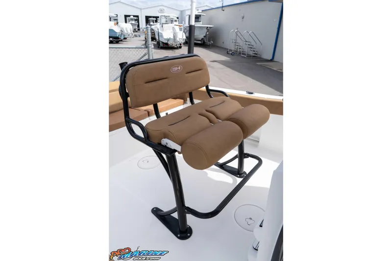 Slide: The Image of 2023 Sea Hunt Ultra 229 boat seat with brown cushioned upholstery. - 31