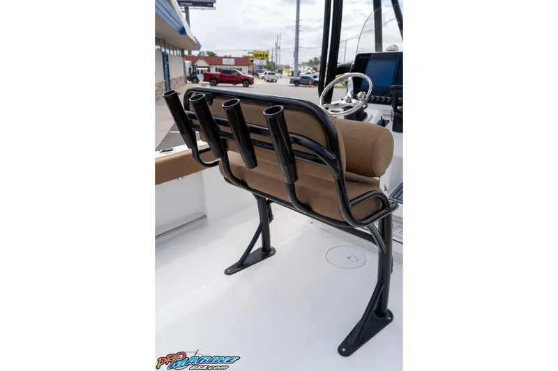 Slide: The Image of 2023 Sea Hunt Ultra 229 boat with rod holders and steering console. - 33