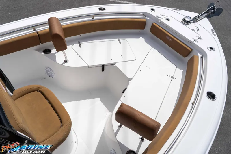 Slide: The Image of 2023 Sea Hunt Ultra 229 boat interior with cushioned seating and table. - 37