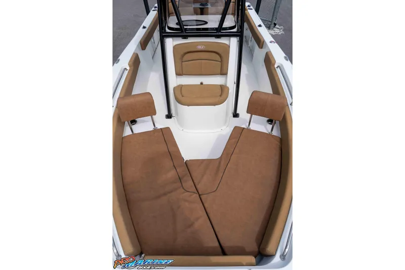 Slide: The Image of 2023 Sea Hunt Ultra 229 boat interior with brown cushioned seating. - 39