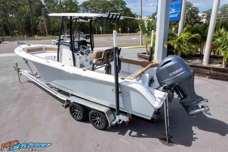 Slide: The Image of 2023 Sea Hunt Ultra 229 boat with Yamaha engine on trailer, parked outdoors. - 42