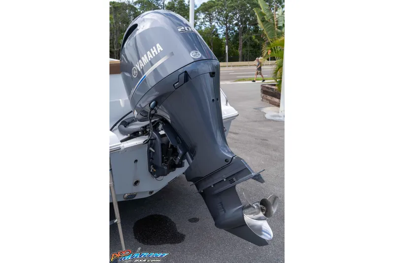 Slide: The Image of Yamaha outboard motor on 2023 Sea Hunt Ultra 229 boat, parked outdoors. - 5