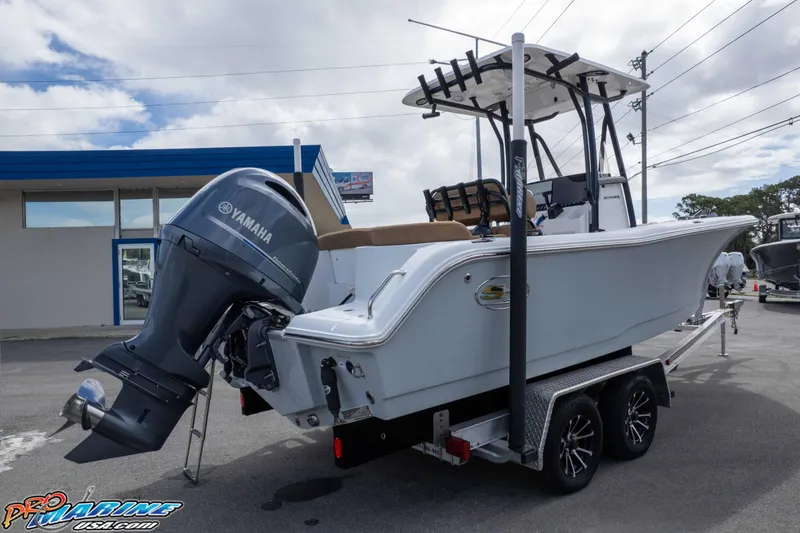 Slide: The Image of 2023 Sea Hunt Ultra 229 boat with Yamaha engine on trailer, parked outdoors. - 8