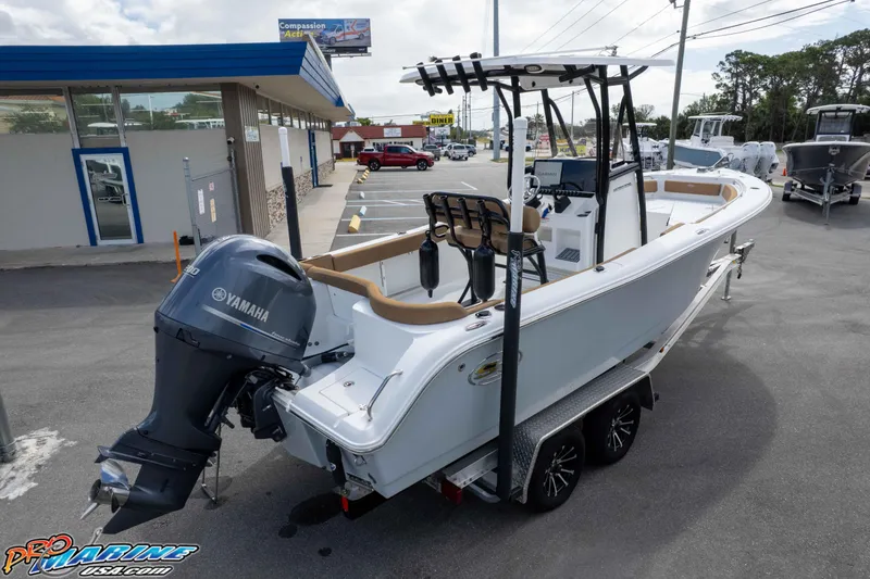 Slide: The Image of 2023 Sea Hunt Ultra 229 boat with Yamaha engine on trailer in dealership lot. - 9