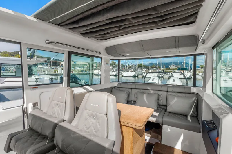 Slide: The Image of Luxurious interior of 2021 Axopar 37 XC Cross Cabin with marina view. - 14