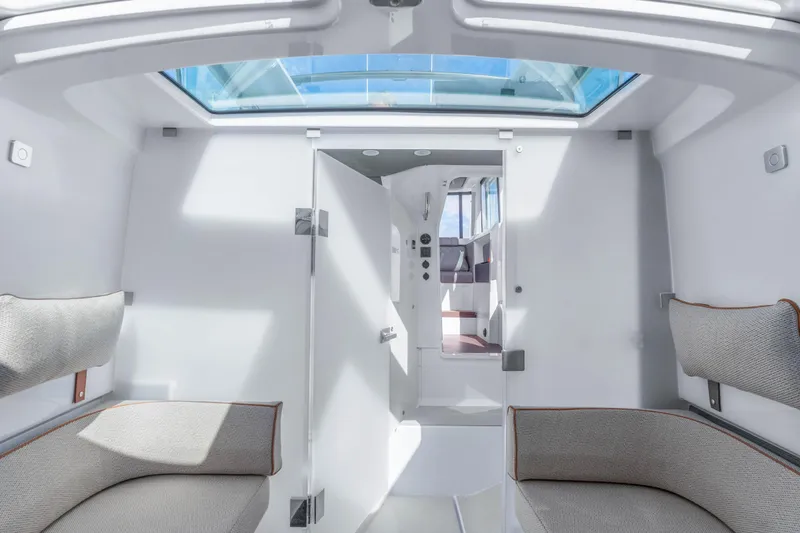 Slide: The Image of Interior of 2021 Axopar 37 XC Cross Cabin with skylight and seating. - 20