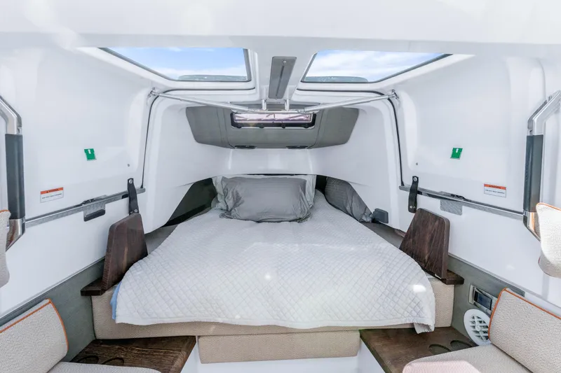 Slide: The Image of Interior cabin of 2021 Axopar 37 XC Cross Cabin with bed and skylights. - 21