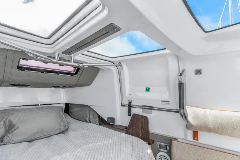 Slide: The Image of Interior cabin of 2021 Axopar 37 XC Cross Cabin with skylight and bedding. - 23