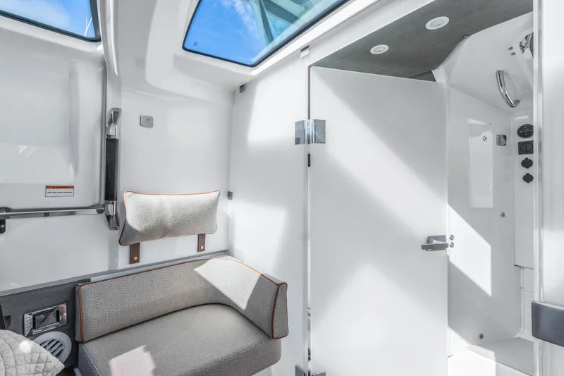 Slide: The Image of Interior of 2021 Axopar 37 XC Cross Cabin, featuring modern seating and sleek design. - 24