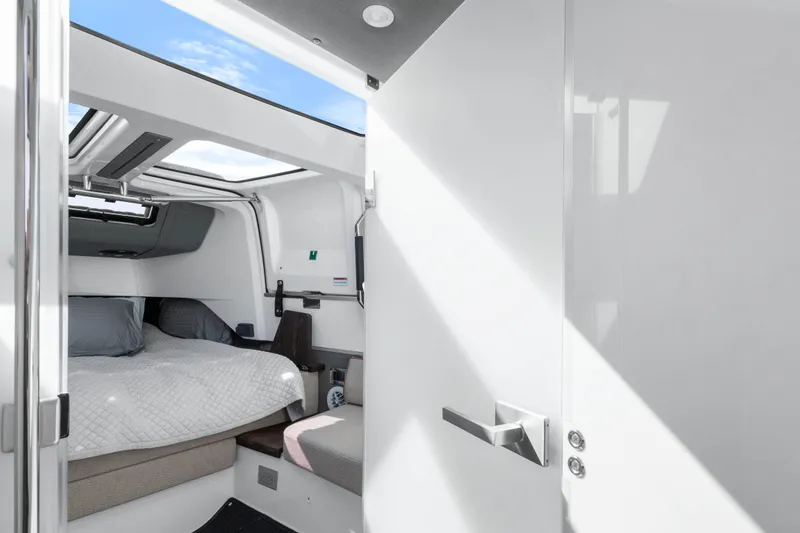 Slide: The Image of Interior cabin of 2021 Axopar 37 XC Cross Cabin with bed and skylight. - 25