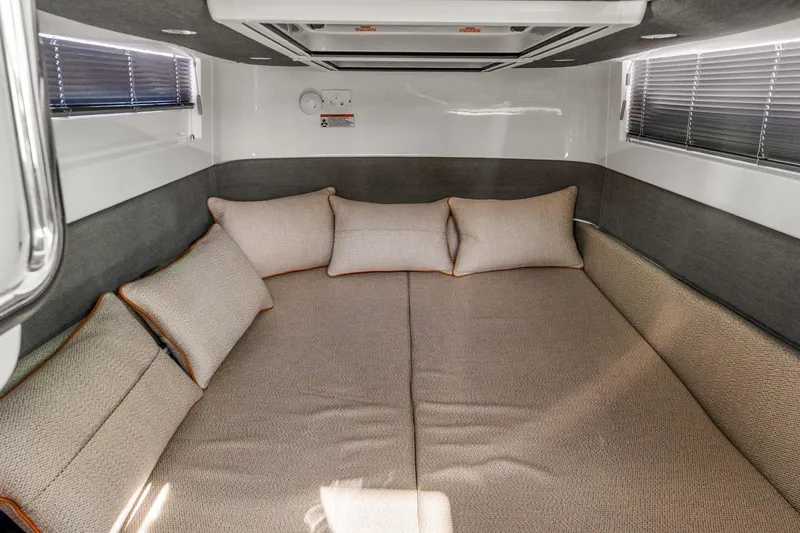 Slide: The Image of Cozy cabin interior of 2021 Axopar 37 XC Cross Cabin with plush cushions. - 30