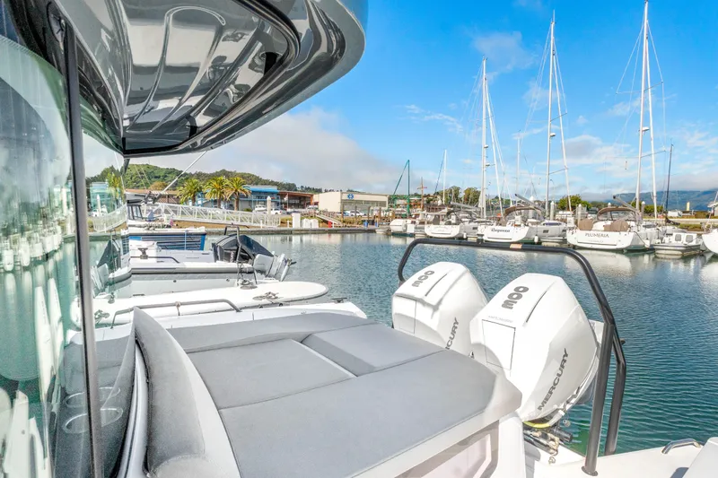 Slide: The Image of 2021 Axopar 37 XC Cross Cabin boat docked in a marina with clear skies. - 39