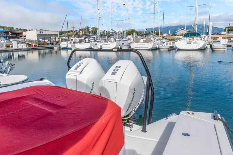 Slide: The Image of 2021 Axopar 37 XC Cross Cabin with Mercury engines docked at marina. - 41