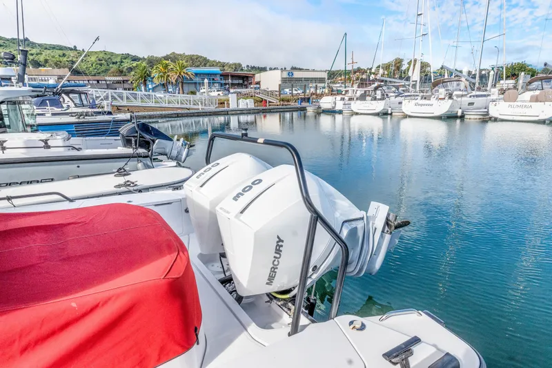 Slide: The Image of 2021 Axopar 37 XC Cross Cabin with Mercury engines docked at marina. - 42