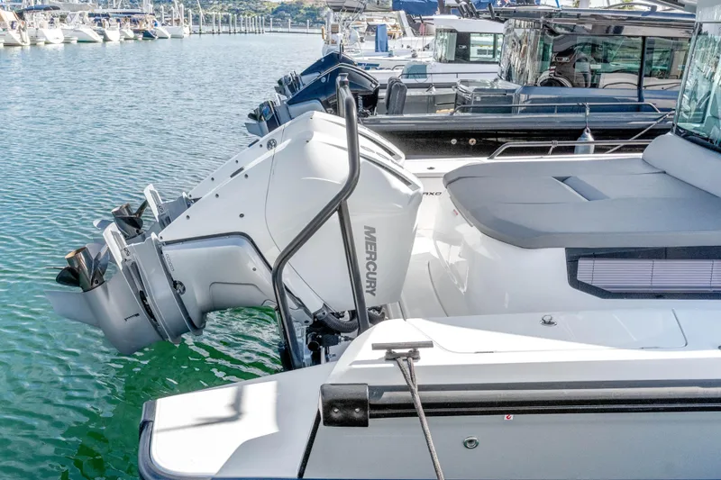 Slide: The Image of 2021 Axopar 37 XC Cross Cabin with Mercury outboard engines docked at marina. - 5