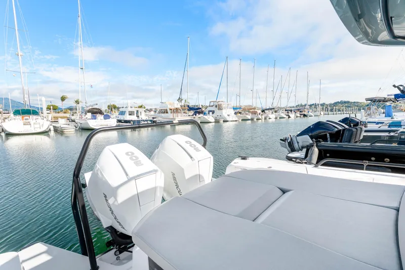 Slide: The Image of 2021 Axopar 37 XC Cross Cabin in marina with outboard engines. - 6