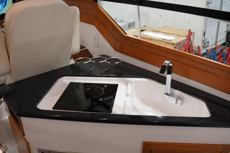 Slide: The Image of 2024 True North 34 yacht interior with sleek sink and modern faucet design. - 13