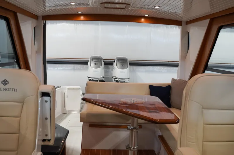Slide: The Image of Luxurious interior of 2024 True North 34 boat with elegant seating and wooden table. - 17