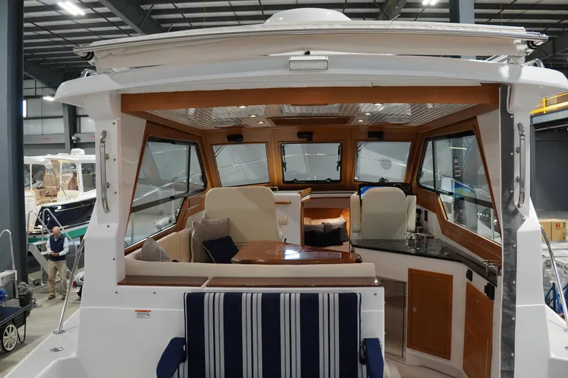 Slide: The Image of Interior view of 2024 True North 34 yacht, featuring elegant seating and modern design. - 21