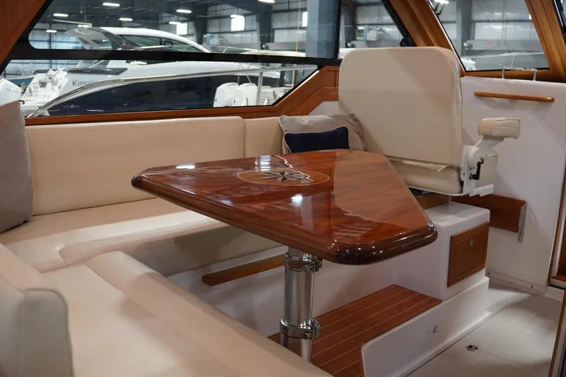 Slide: The Image of Luxurious interior of 2024 True North 34 yacht with elegant wood table and seating. - 3
