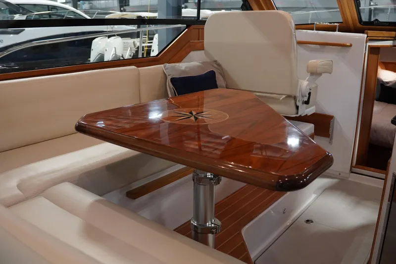Slide: The Image of Luxurious interior of 2024 True North 34 yacht with elegant wooden table and seating. - 6