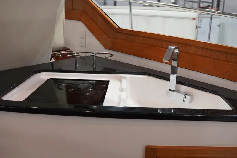 Slide: The Image of Modern kitchen sink and faucet on 2024 True North 34 yacht. - 9