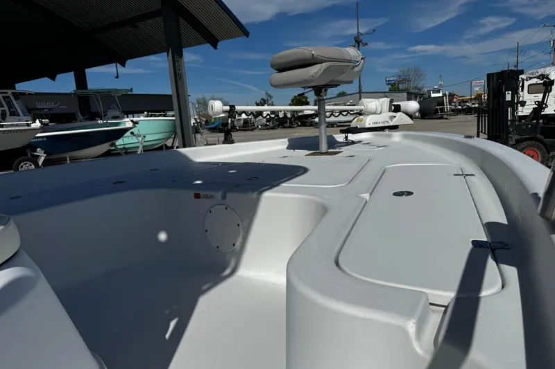 Slide: The Image of 2006 Champion 24 Bay Champ boat interior with seating and storage compartments. - 13