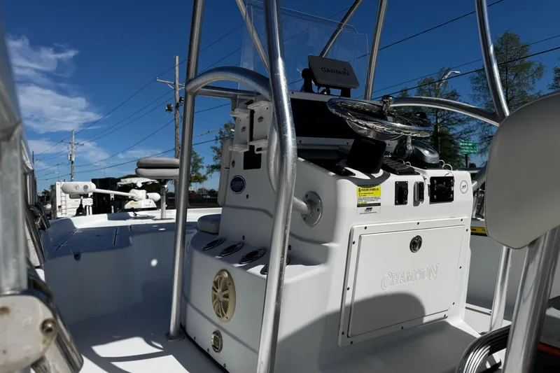 Slide: The Image of 2006 Champion 24 Bay Champ boat interior with steering console and equipment. - 18