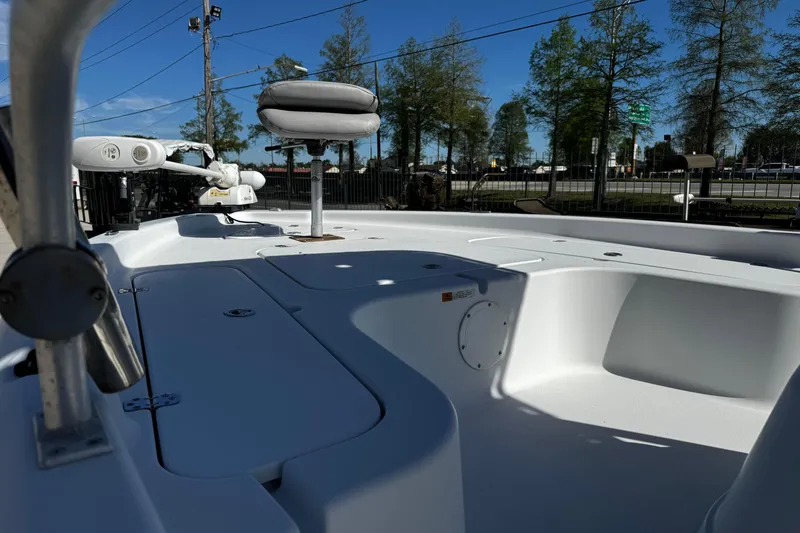 Slide: The Image of 2006 Champion 24 Bay Champ boat interior with seating and storage compartments. - 9