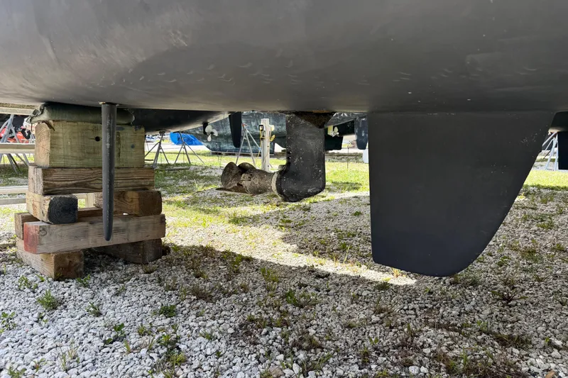 Slide: The Image of Underneath view of a 2016 Outremer 45 catamaran hull on a gravel surface. - 102