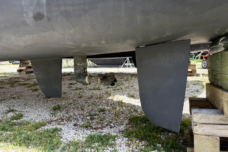 Slide: The Image of Underneath view of a 2016 Outremer 45 catamaran on dry land. - 103
