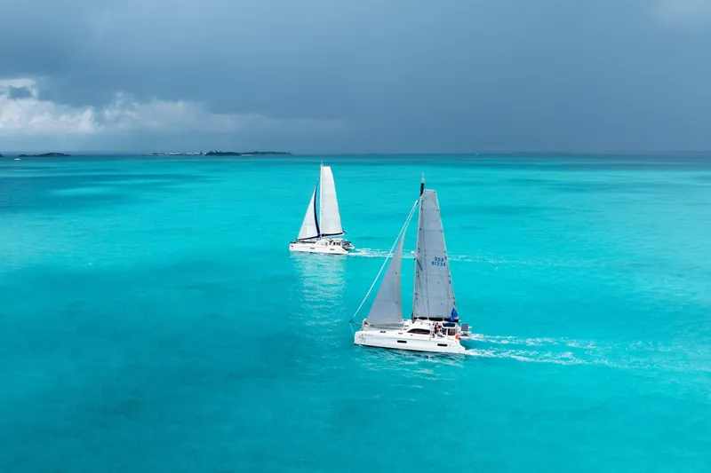 Slide: The Image of Sailing catamaran Outremer 45, 2016 model, gliding on blue ocean waters. - 114