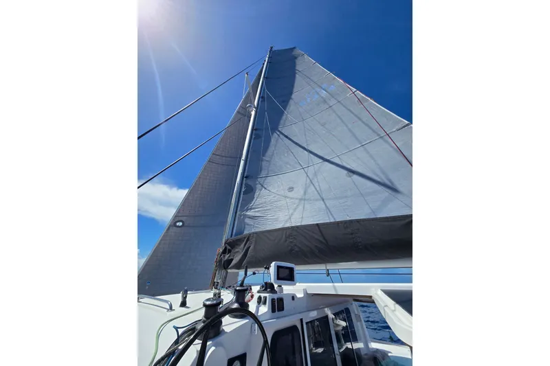 Slide: The Image of Sailing on a 2016 Outremer 45 catamaran under clear blue skies. - 15