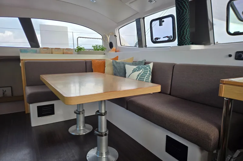 Slide: The Image of Interior of 2016 Outremer 45 catamaran with cozy seating and modern dining area. - 2