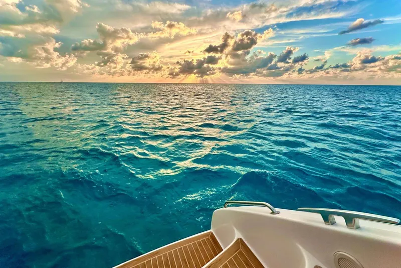 Slide: The Image of Outremer 45 yacht deck overlooking serene ocean at sunset, 2016 model. - 23