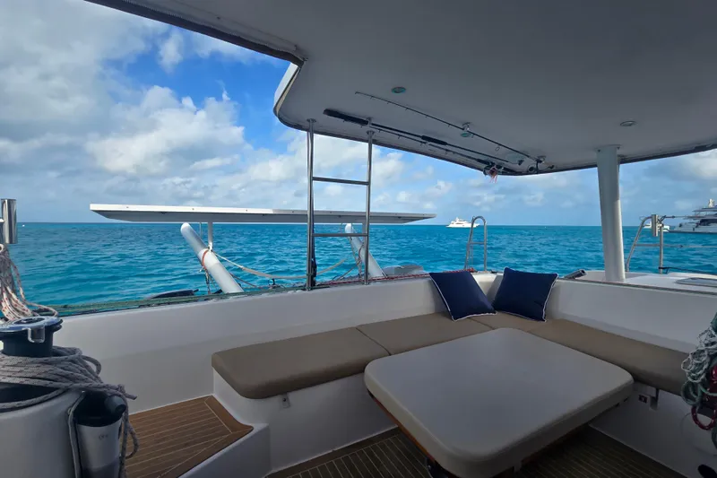 Slide: The Image of Outremer 45 catamaran interior with ocean view, featuring comfortable seating, 2016 model. - 28