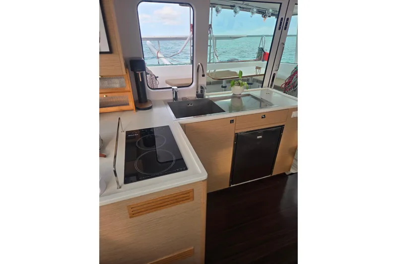 Slide: The Image of Modern kitchen interior of 2016 Outremer 45 catamaran with ocean view. - 3