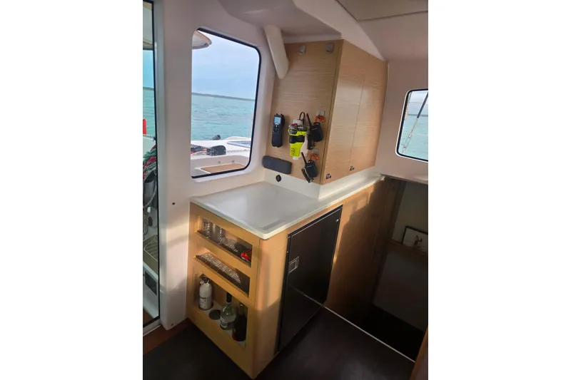 Slide: The Image of Interior of 2016 Outremer 45 catamaran with modern kitchen and ocean view. - 30