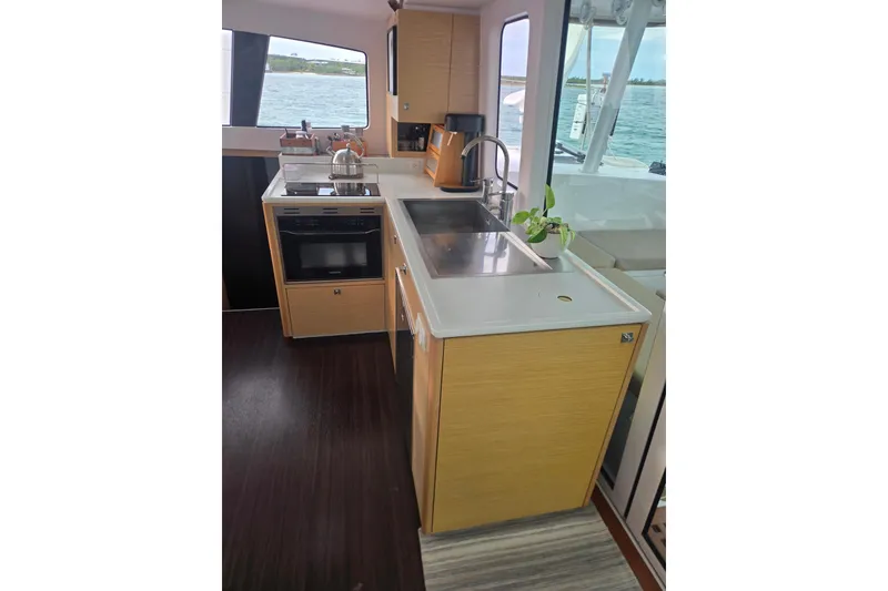 Slide: The Image of Modern kitchen interior of 2016 Outremer 45 catamaran with sleek countertops and ocean view. - 35