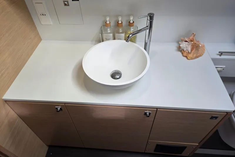 Slide: The Image of Modern bathroom sink on Outremer 45 yacht, featuring sleek design and elegant fixtures. - 38