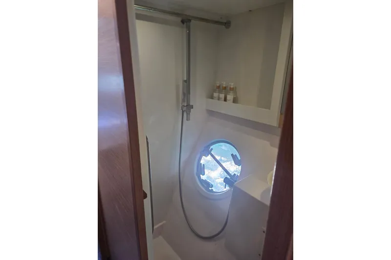 Slide: The Image of Bathroom interior of 2016 Outremer 45 yacht with shower and porthole. - 44