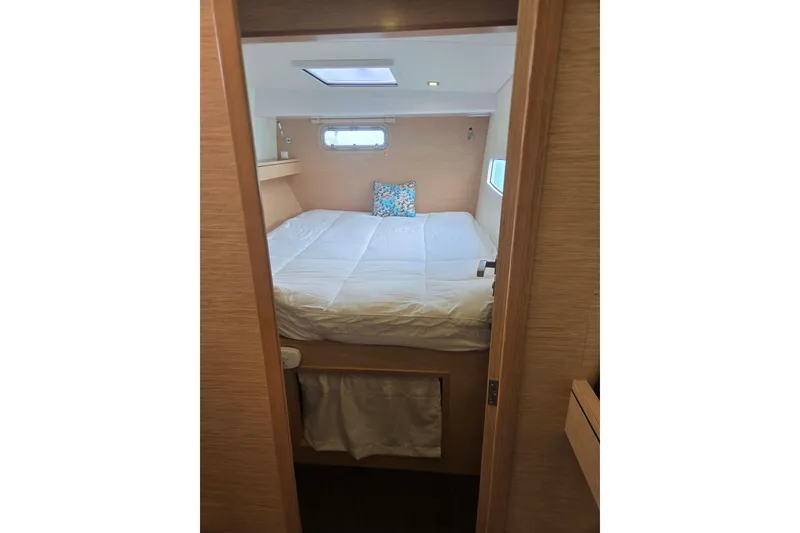 Slide: The Image of Cozy cabin interior of 2016 Outremer 45 yacht with skylight and bedding. - 5