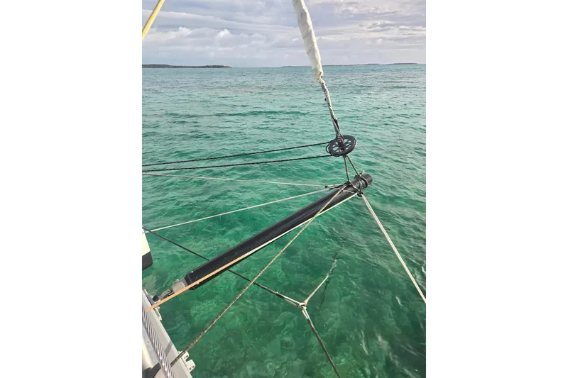 Slide: The Image of Outremer 45 catamaran sailing on clear turquoise waters, 2016 model. - 52