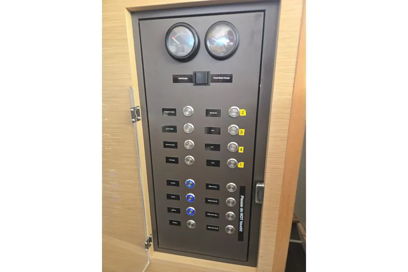 Slide: The Image of Electrical panel on a 2016 Outremer 45 yacht with gauges and switches. - 55