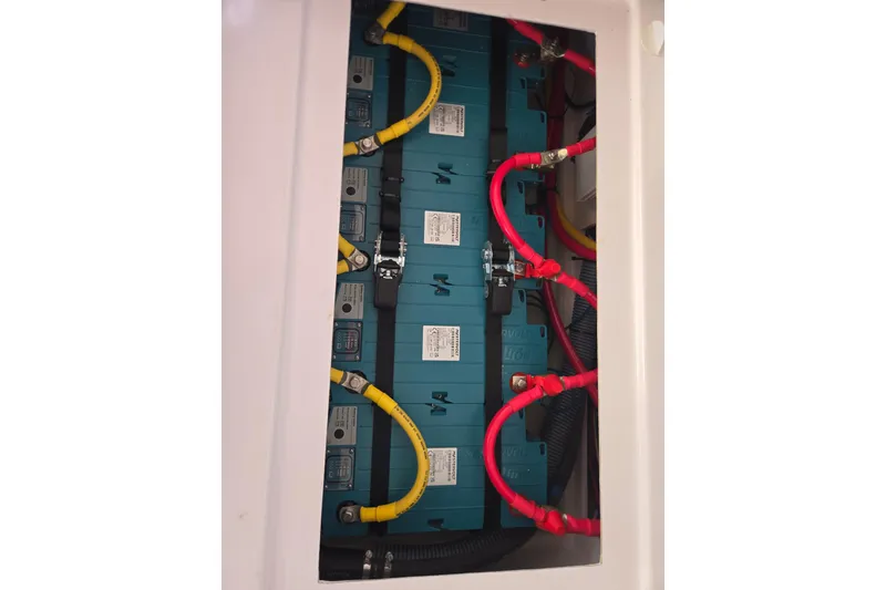 Slide: The Image of Battery compartment of a 2016 Outremer 45 yacht with red and yellow cables. - 56