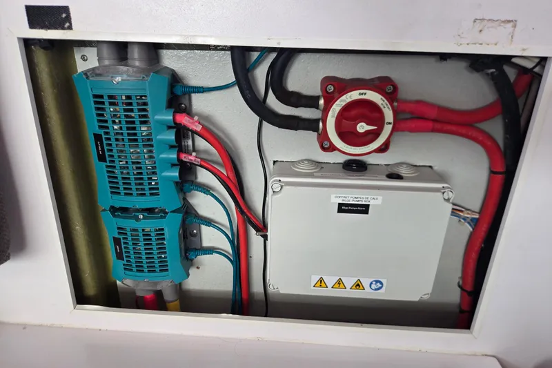 Slide: The Image of Electrical panel of a 2016 Outremer 45 yacht with wiring and switches. - 57