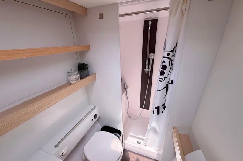 Slide: The Image of Modern bathroom in 2016 Outremer 45 yacht with shower and wooden shelves. - 65