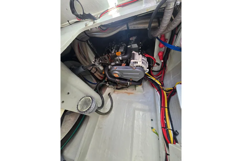 Slide: The Image of Engine compartment of a 2016 Outremer 45 catamaran, showcasing wiring and components. - 7